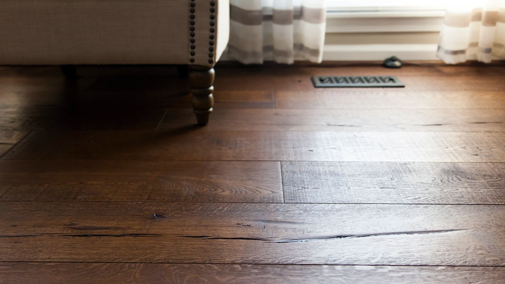 Hardwood styled flooring brings flare and uses simplicity to create a homey space.
