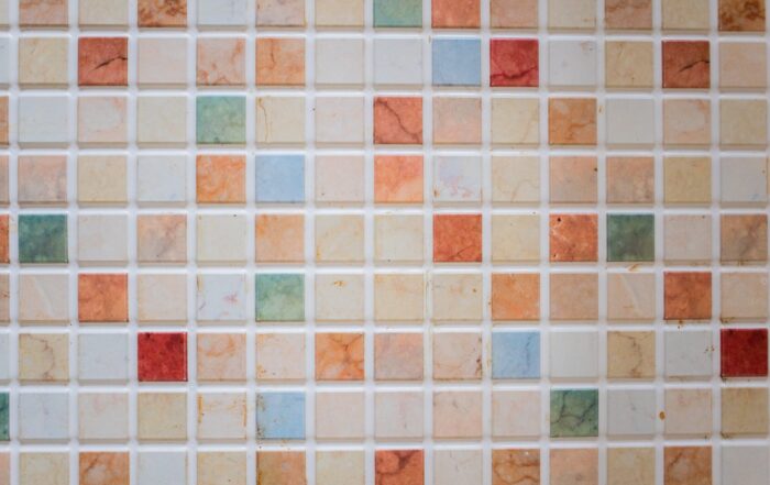 small tiles of different colors come together to create a soft and peaceful effect on this bathroom floor.