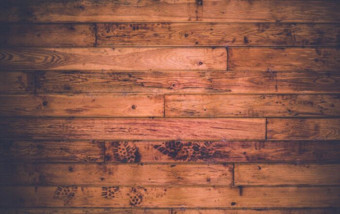A top-down view of beautiffully stained wide plank hardwood found among the 2024 flooring trends.